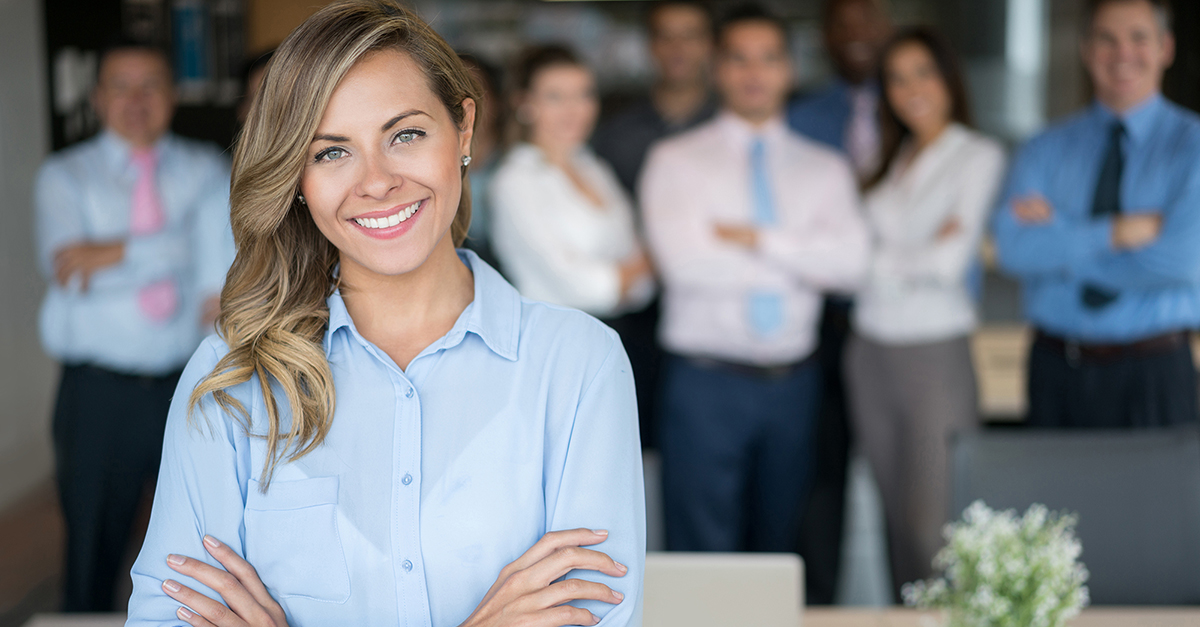 Successful business woman leading a group sales course training session